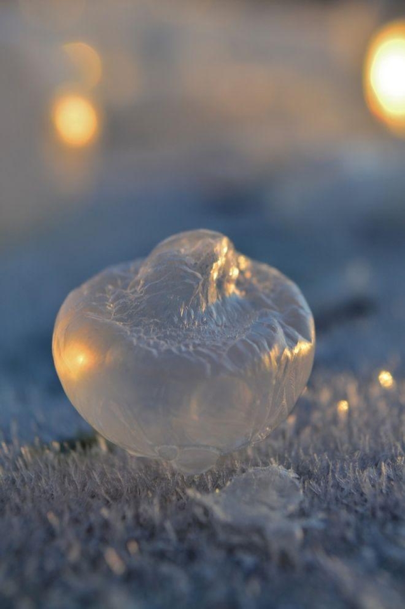 Crystal balls — a girl photographs soap bubbles in the cold Crystal balls — a girl photographs soap bubbles in the cold