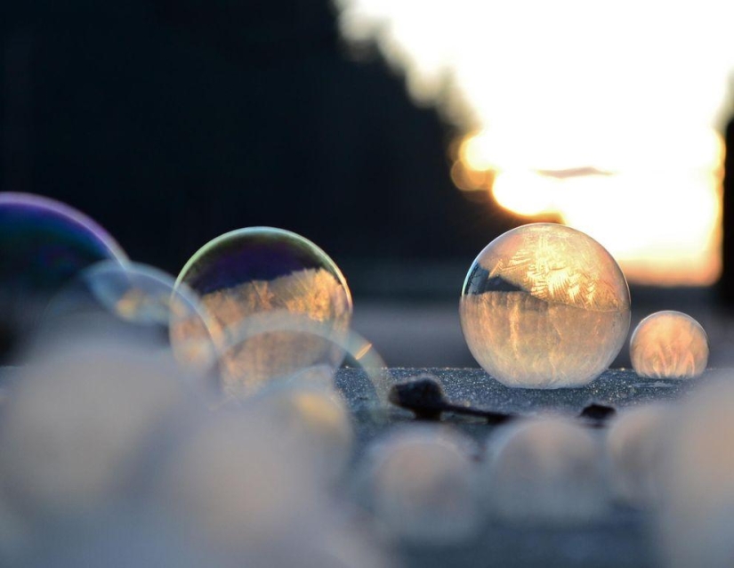 Crystal balls — a girl photographs soap bubbles in the cold Crystal balls — a girl photographs soap bubbles in the cold