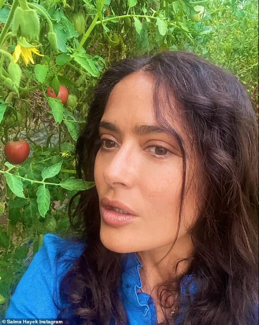 Salma Hayek, 57, is a makeup-free beauty as she eats a strawberry fresh off the vine during trip to 'magical' island in Italy