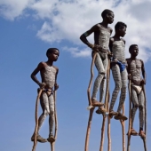 Always on top: why Banna men prefer to walk on stilts Always on top: why Banna men prefer to walk on stilts