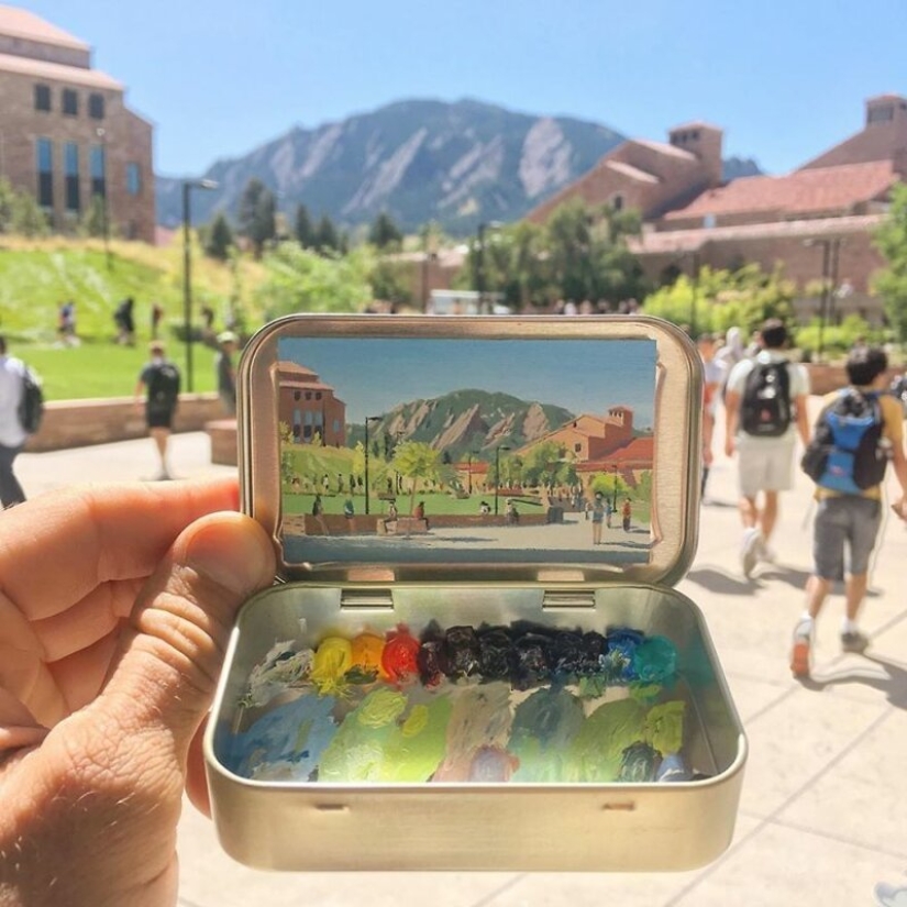 Artista dibuja las miniaturas de los paisajes en las cajas del caramelo