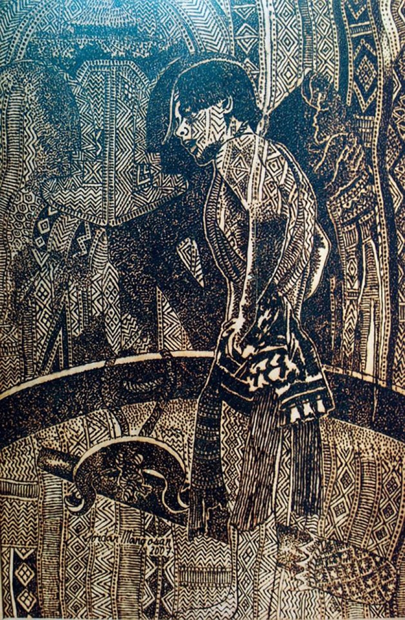 El artista dibuja con una lupa y la luz del sol El artista dibuja con una lupa y la luz del sol