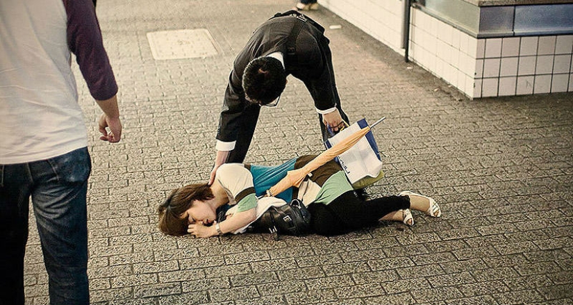 Exhausted Tokyo residents sleeping on the street