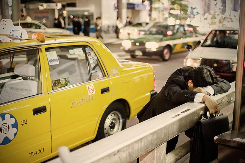 Exhausted Tokyo residents sleeping on the street