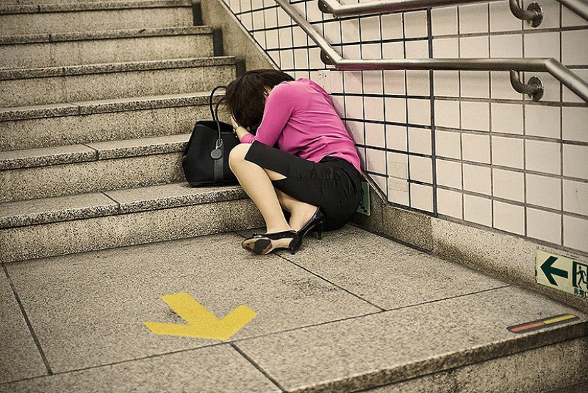 Exhausted Tokyo residents sleeping on the street