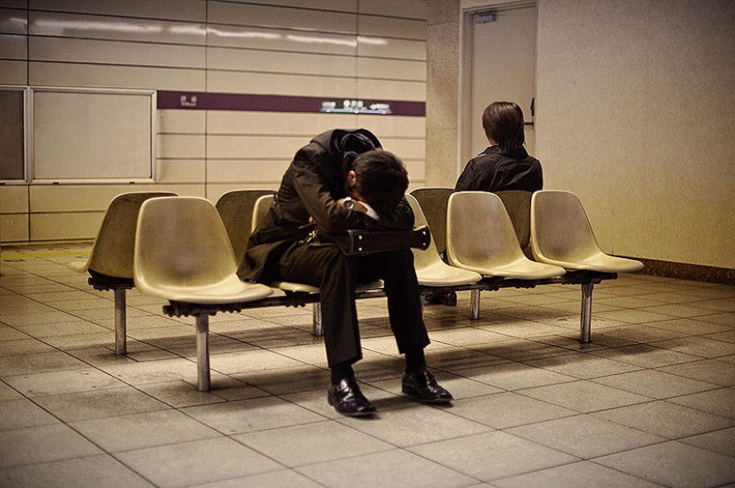 Exhausted Tokyo residents sleeping on the street