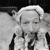 Happy pig farmer and his pets Happy pig farmer and his pets