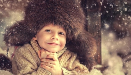 How did the hat-earflaps appear and why is it not a native Russian headdress