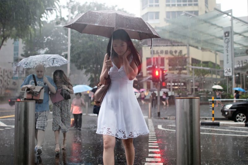 Rainy mood: a photographer from Singapore catches the emotions of people during a downpour