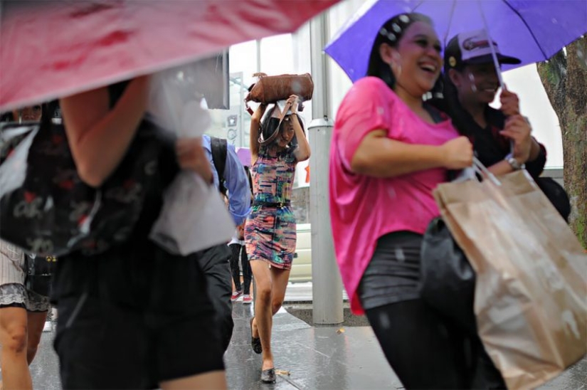 Rainy mood: a photographer from Singapore catches the emotions of people during a downpour
