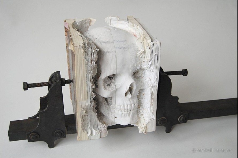 Step-by-step process of carving a skull from old books Step-by-step process of carving a skull from old books