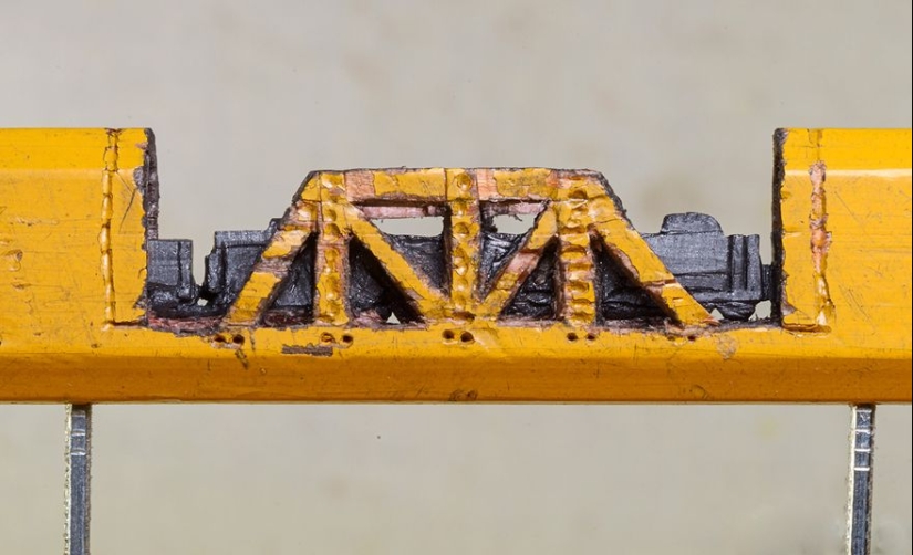 The artist cuts out tiny masterpieces from pencil slates