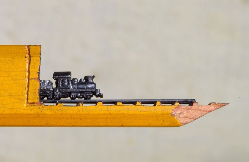 The artist cuts out tiny masterpieces from pencil slates