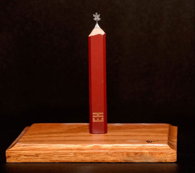 The artist cuts out tiny masterpieces from pencil slates