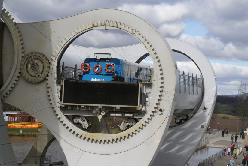 The Falkirk Wheel is a unique rotating structure that lifts entire ships