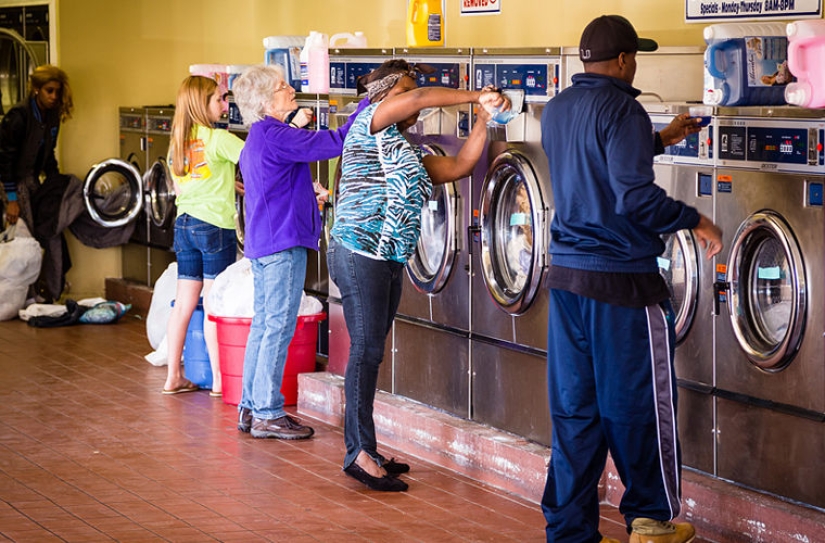 Why do Americans do laundry in laundries and not at home?