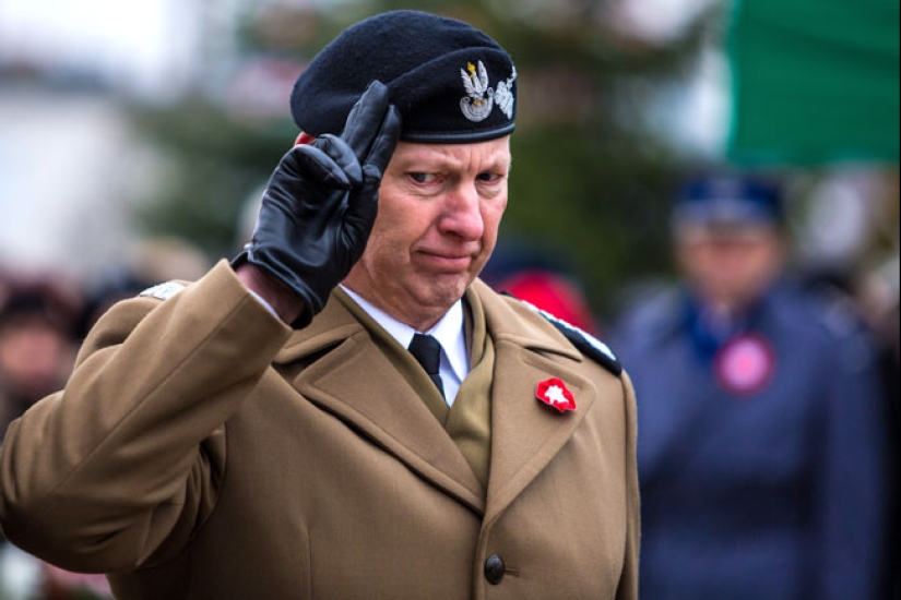 Why do the military salute by putting their hand to their head