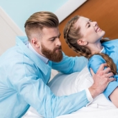 Why do women give birth lying down and what does King Louis XIV have to do with it