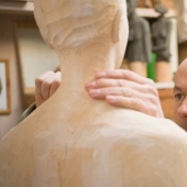 Youth captured in hyper-realistic wood sculptures