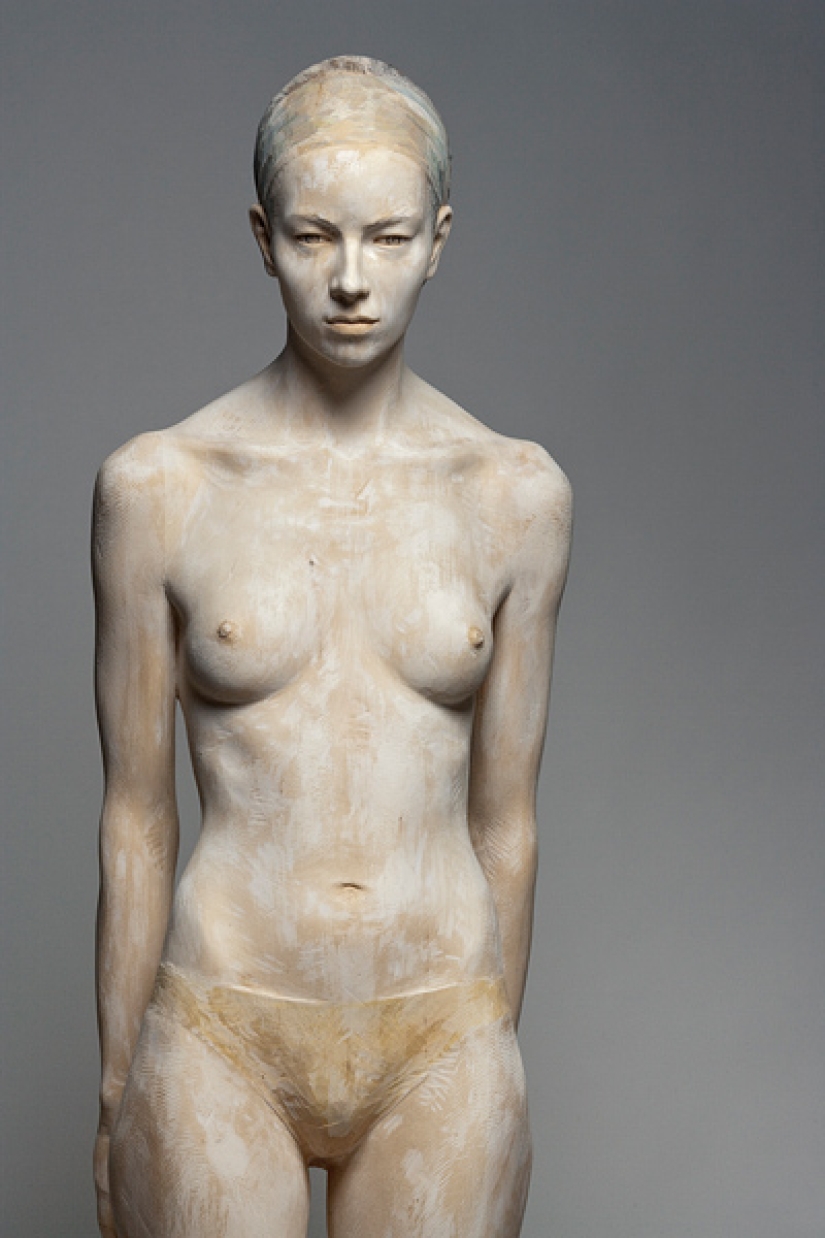 Youth captured in hyper-realistic wood sculptures